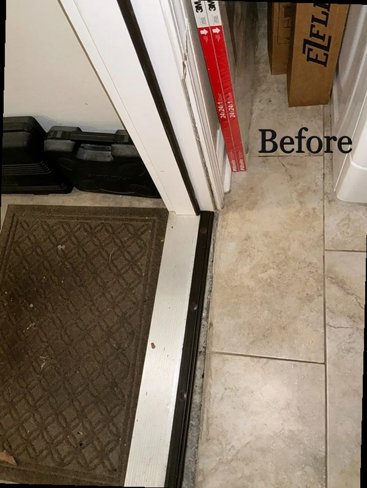Worn door threshold before sweep replacement