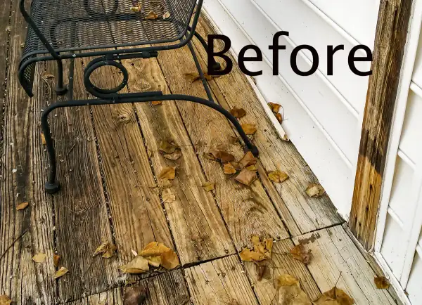 Rotted deck boards before siding repair
