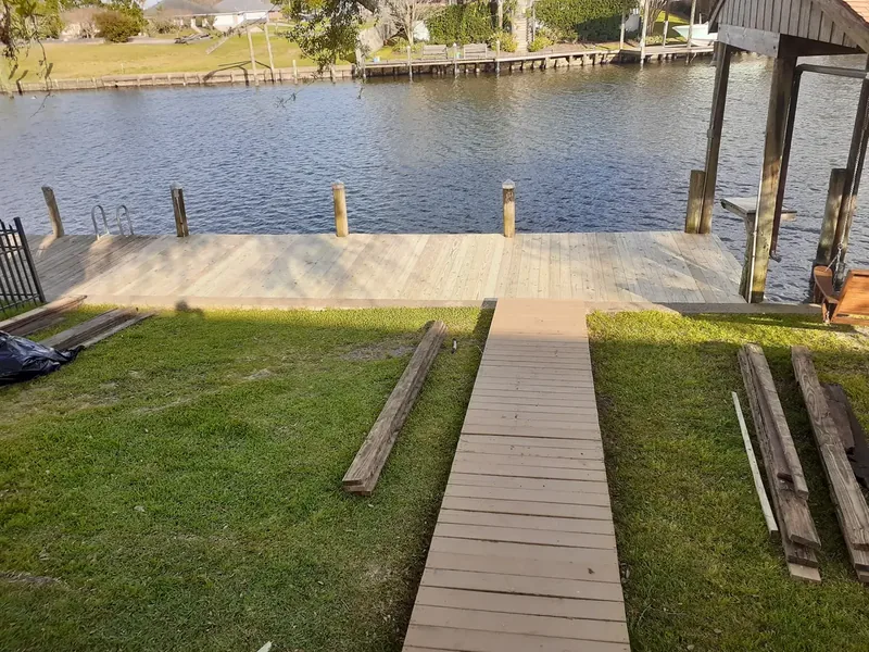 New wooden walkway leading out to the repaired dock